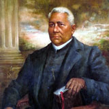 Portrait of an African American clergyman, holding a bible. Blue suit with white collar.